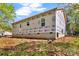 Exterior side view of a home with a wrap, windows, and a foundation at 1235 E Poplar St, Conover, NC 28613