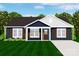 Charming rendering of a home with dark blue siding, brown shutters, and a well-manicured lawn at 1235 E Poplar St, Conover, NC 28613