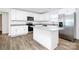 Modern kitchen featuring an island, stainless steel appliances, and white cabinetry at 1235 E Poplar St, Conover, NC 28613