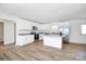 Modern kitchen featuring white cabinets, stainless steel appliances and a kitchen island at 1235 E Poplar St, Conover, NC 28613