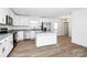 Modern kitchen featuring white cabinets, stainless steel appliances and a kitchen island at 1235 E Poplar St, Conover, NC 28613