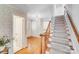 Inviting foyer with hardwood floors and a staircase leading to the upper level at 1327 Cedarwood Ln, Charlotte, NC 28212