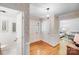 Light and bright foyer with hardwood floors, fresh paint, and views of the living room at 1327 Cedarwood Ln, Charlotte, NC 28212