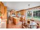 Charming kitchen boasts wood cabinets, a center island with white countertop and adjacent breakfast nook at 1327 Cedarwood Ln, Charlotte, NC 28212