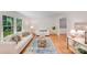 Cozy living room with hardwood floors, natural light and neutral furniture at 1327 Cedarwood Ln, Charlotte, NC 28212