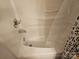 Clean white bathtub with modern fixtures and shower curtain partially visible at 13316 E Rocky River Rd, Davidson, NC 28036