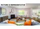 Comfortable living room with a fireplace, plush seating, and ample natural light at 134 Woodhall Way, Troutman, NC 28166
