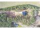 An aerial shot of a secluded home with a long driveway, surrounded by dense forest for ultimate privacy at 13625 Buster Rd, Stanfield, NC 28163