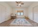 Bright bedroom with a neutral palette, ceiling fan, a crib, window, and wood-look floors at 13625 Buster Rd, Stanfield, NC 28163