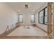 Versatile bonus room filled with natural light, neutral carpet, and windows with wooded views at 13625 Buster Rd, Stanfield, NC 28163