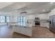Spacious kitchen featuring a center island, stainless steel appliances, and modern fixtures at 13625 Buster Rd, Stanfield, NC 28163