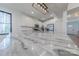 Close up of a kitchen island with marble countertop, stainless appliances and a large window at 13625 Buster Rd, Stanfield, NC 28163