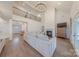 A living room with high ceilings, wood floors, a fireplace, and many windows at 13625 Buster Rd, Stanfield, NC 28163