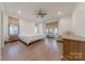 A main bedroom with a king bed, wood floors and many windows at 13625 Buster Rd, Stanfield, NC 28163