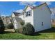 Street view of the home, showcasing its basic structure and yard, awaiting repairs at 1421 Braveheart Ln, Charlotte, NC 28216