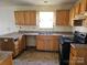 Outdated kitchen featuring wooden cabinets, counters and flooring at 1421 Braveheart Ln, Charlotte, NC 28216
