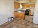 Dated kitchen featuring wooden cabinets, counters and flooring at 1421 Braveheart Ln, Charlotte, NC 28216