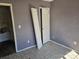 Room with purple walls, loose doors and tiled floors at 1421 Braveheart Ln, Charlotte, NC 28216
