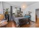 Comfortable bedroom boasts hardwood floors, ample natural light, and tasteful furnishings at 1519 The Plz, Charlotte, NC 28205
