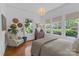 Bright bedroom featuring hardwood floors, many windows, and neutral walls at 1519 The Plz, Charlotte, NC 28205