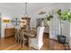 Charming dining room with hardwood floors, neutral tones, and access to the living room at 1519 The Plz, Charlotte, NC 28205