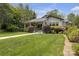 Lovely home with a lush green lawn, manicured landscaping, and a welcoming walkway at 1519 The Plz, Charlotte, NC 28205