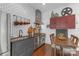 Functional kitchen with stainless appliances, subway tile backsplash, and dining area at 1519 The Plz, Charlotte, NC 28205