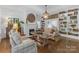 Cozy living room with a fireplace, built-in bookshelves, and hardwood flooring at 1519 The Plz, Charlotte, NC 28205