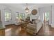 Bright living room boasting hardwood floors, neutral colors, a fireplace, and lots of natural light at 1519 The Plz, Charlotte, NC 28205
