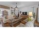 Comfortable living room with a large decorative table, neutral decor, and view to the dining room at 1519 The Plz, Charlotte, NC 28205