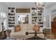 Inviting living room featuring built-in bookshelves, a cozy fireplace, and access to the dining room at 1519 The Plz, Charlotte, NC 28205