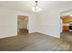 Open dining room with wood-look floors seamlessly connecting to the entryway and kitchen at 1520 Venture Oaks Ln, Monroe, NC 28110