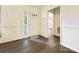 Bright entryway featuring wood-look flooring, a front door with glass, and neutral walls at 1520 Venture Oaks Ln, Monroe, NC 28110