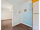 Hallway with light blue wall paint, light wood floor, and white trim molding at 1520 Venture Oaks Ln, Monroe, NC 28110
