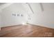 Bright bedroom with vaulted ceilings, recessed lighting, hardwood floors, and a double window at 157 Silver Falls Dr, Troutman, NC 28166