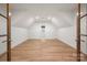 Large Bonus Room with vaulted ceilings, hardwood floors, recessed lighting, and a charming window at 157 Silver Falls Dr, Troutman, NC 28166