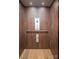 Modern elevator featuring rich wood paneling, stainless steel accents, and a sleek control panel for easy access at 157 Silver Falls Dr, Troutman, NC 28166