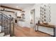 Inviting foyer with hardwood floors, a decorative mirror, and stairway leading to upper level at 157 Silver Falls Dr, Troutman, NC 28166