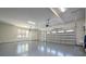 Bright and spacious garage with epoxy flooring, windows and two doors, offering ample room for vehicles and storage at 157 Silver Falls Dr, Troutman, NC 28166