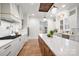 Well-appointed kitchen with marble backsplash, island, modern appliances, and custom cabinetry at 157 Silver Falls Dr, Troutman, NC 28166