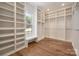 Spacious walk-in closet with custom shelves and window bench seat, creating organized storage at 157 Silver Falls Dr, Troutman, NC 28166