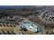Aerial view of neighborhood amenities including clubhouse, waterpark, and proximity to schools at 1857 Felts Pkwy, Fort Mill, SC 29715