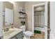 A well-lit bathroom features a single sink vanity and leads to an adjacent shower/tub room at 1857 Felts Pkwy, Fort Mill, SC 29715