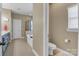 Bathroom with tile flooring, double sink, toilet, tub, glass shower, and neutral walls at 1857 Felts Pkwy, Fort Mill, SC 29715