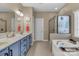 Full bathroom with tub, shower, double sink, vanity, and tile flooring at 1857 Felts Pkwy, Fort Mill, SC 29715