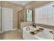 Bathroom featuring a soaking tub, walk in shower and large window at 1857 Felts Pkwy, Fort Mill, SC 29715