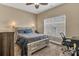 Bedroom area with a bed, desk, and window to provide plenty of natural light at 1857 Felts Pkwy, Fort Mill, SC 29715