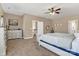 Spacious bedroom features neutral walls, ceiling fan, white trim, and carpet flooring at 1857 Felts Pkwy, Fort Mill, SC 29715