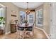 Cozy breakfast nook bathed in natural light, featuring a wooden table and chairs, perfect for morning gatherings at 1857 Felts Pkwy, Fort Mill, SC 29715