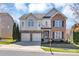 Beautiful two-story home with a two car garage and manicured front yard at 1857 Felts Pkwy, Fort Mill, SC 29715